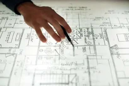Architectural firms. Close up of hands working on layout