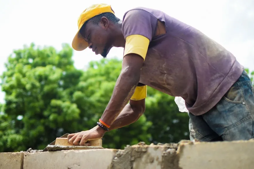Worker adhering to building codes in nigeria  

