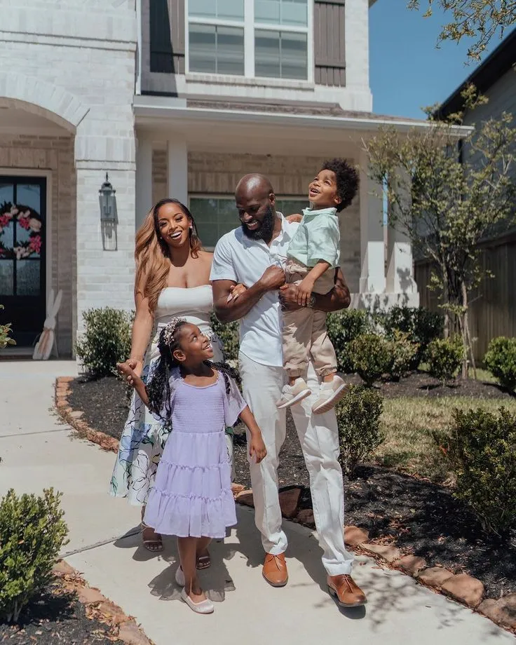 Happy Nigerian family in a new home
