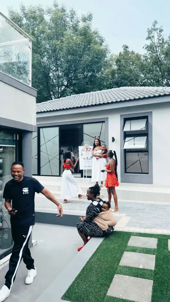 Happy family group touring a modern home development in Nigeria