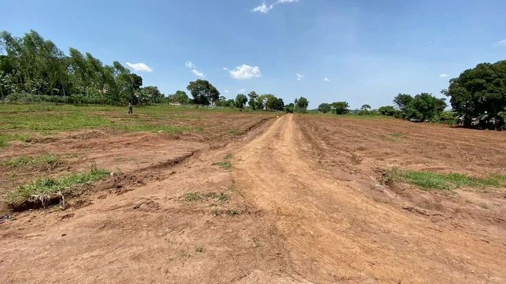 Developing land estate with plots marked in a growing Nigerian suburb